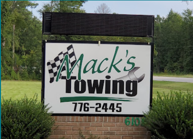 Mack's Towing sign at the shop